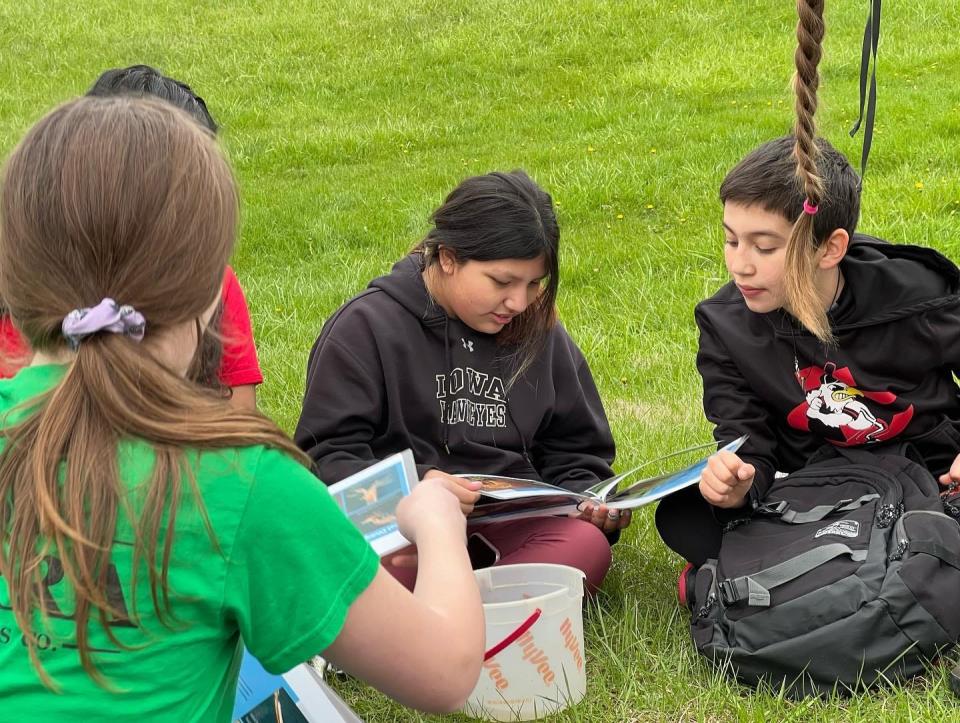 Fifth-grade students from Hills Elementary participate in a field trip at Cangleska Wakan in Johnson County on April 29. It was part of the Iowa Youth Writing Project's "Writing on the Environment" series. Students and families will return Saturday, when some of their work will be read.