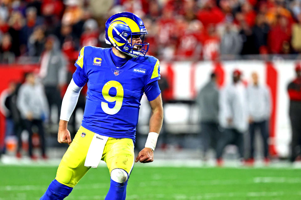 Jan 23, 2022; Tampa, Florida, USA; Los Angeles Rams quarterback Matthew Stafford (9) celebrates after completing a pass during the second half against the Tampa Bay Buccaneers in a NFC Divisional playoff football game at Raymond James Stadium. Mandatory Credit: Kim Klement-USA TODAY Sports