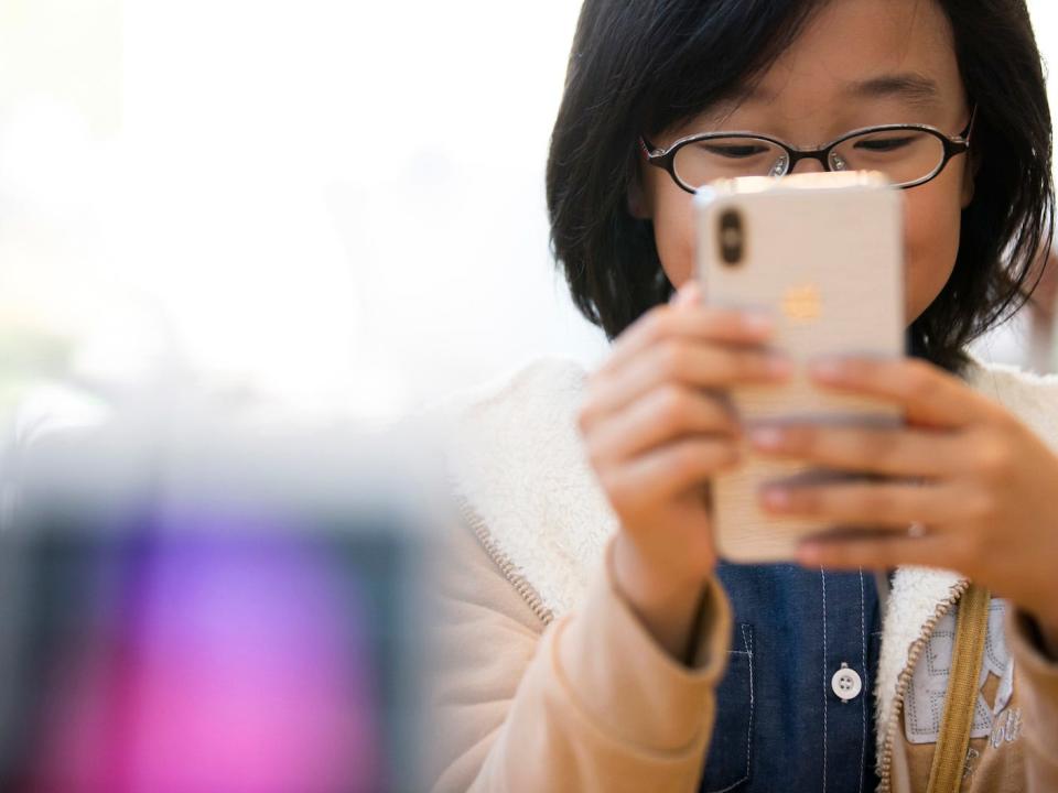 Child looking at phone