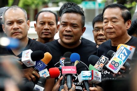 Red shirt leader Jatuporn Prompan speaks with members of Thai media as he arrives at the United Nations building in Bangkok, Thailand, June 20, 2016. REUTERS/Chaiwat Subprasom