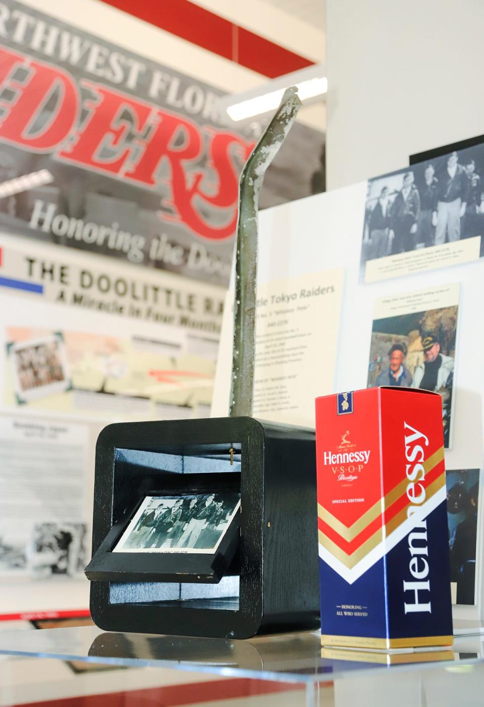 A piece from one of the B-25 bombers that was part of the Doolittle Raiders bombing mission over Japan in the early days of World War II and the bottle of cognac used in the recent "Final Goblet" ceremony honoring the Raiders are the latest additions to the Doolittle Raiders exhibit in the lobby of Raider Arena at Northwest Florida State College.