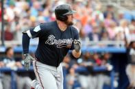 Mar 20, 2019; Dunedin, FL, USA; Atlanta Braves first baseman Andy Wilkins (96) hits a home run during the second inning against the Toronto Blue Jays at Dunedin Stadium. Mandatory Credit: Kim Klement-USA TODAY Sports