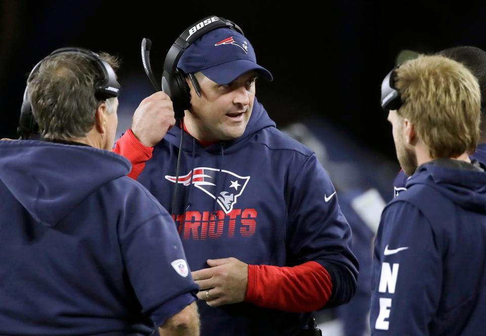 New England Patriots special teams coach Joe Judge, center, speaks to head coach Bill Belichick, left, and safeties coach Steve Belichick, right, in the second half of an NFL football game, Thursday, Oct. 10, 2019, in Foxborough, Mass. (AP Photo/Elise Amendola)