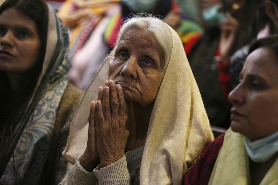 Christians attend a Christmas mass at Sacred Heart Cathedral, in Lahore, Pakistan, on Saturday, Dec. 25, 2021. (AP Photo/K.M. Chaudary)