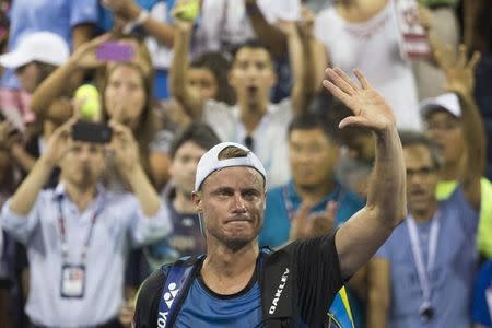 Lleyton Hewitt of Australia waves to fans as he walks off the court following his loss to compatriot Bernard Tomic in their second round match at the U.S. Open Championships tennis tournament in New York, September 3, 2015. REUTERS/Adrees Latif