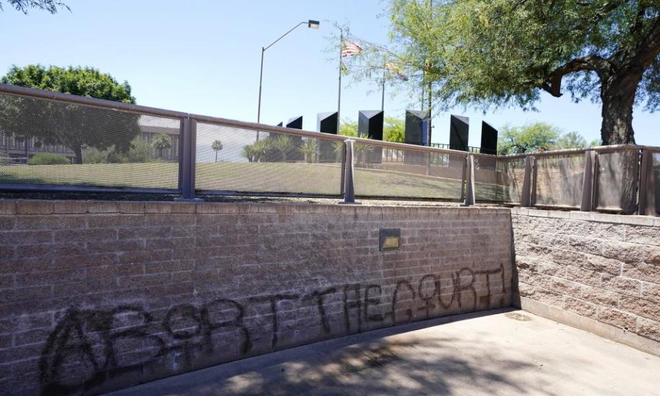 Graffiti sprayed at Wesley Bolin Plaza can be seen after multiple nights of abortion-rights protests at the Arizona capitol in Phoenix in June.