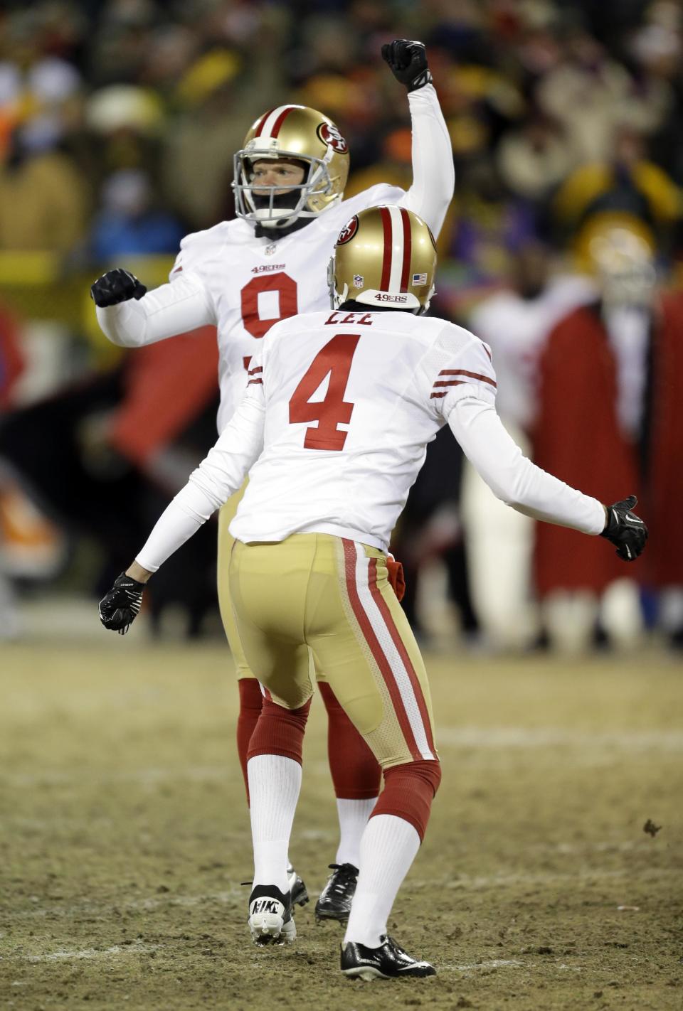 San Francisco 49ers kicker Phil Dawson (9) celebrates after kicking the game-winning field goal during the second half of an NFL wild-card playoff football game, Sunday, Jan. 5, 2014, in Green Bay, Wis. The 49ers won 23-20. (AP Photo/Mike Roemer)