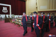 In this photo provided by the North Korean government, North Korean leader Kim Jong Un, front left, carries the coffin of Marshal of the Korean People's Army Hyon Chol Hae at the April 25 House of Culture in Pyongyang, North Korea Sunday, May 22, 2022. Independent journalists were not given access to cover the event depicted in this image distributed by the North Korean government. The content of this image is as provided and cannot be independently verified. Korean language watermark on image as provided by source reads: "KCNA" which is the abbreviation for Korean Central News Agency. (Korean Central News Agency/Korea News Service via AP)