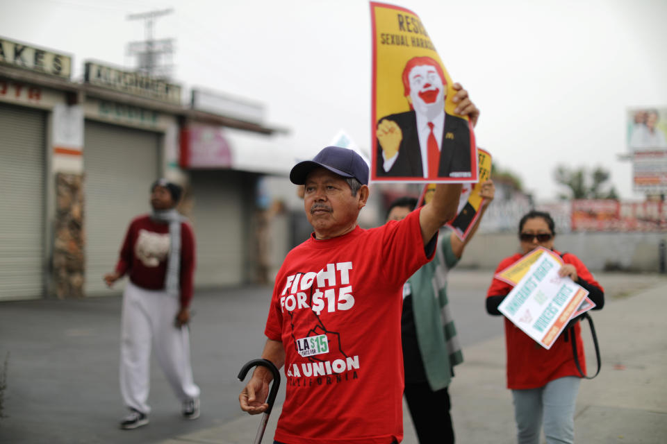 Fast-food workers protest outside of a McDonald's in Los Angeles on May 24, 2017, as part of the Fight for $15 movement. Fight for $15 is calling on President-elect Joe Biden to fire the NRLB's general counsel, Peter Robb. (Photo: Lucy Nicholson / Reuters)