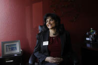 In this Feb. 20, 2020, photo Saili Gosula, executive director of SYNERGY HomeCare of San Mateo, poses for a photo at her office in San Mateo, Calif. Gosula has a remote administrative staffer and several onsite employees at her Synergy HomeCare franchise. (AP Photo/Jeff Chiu)