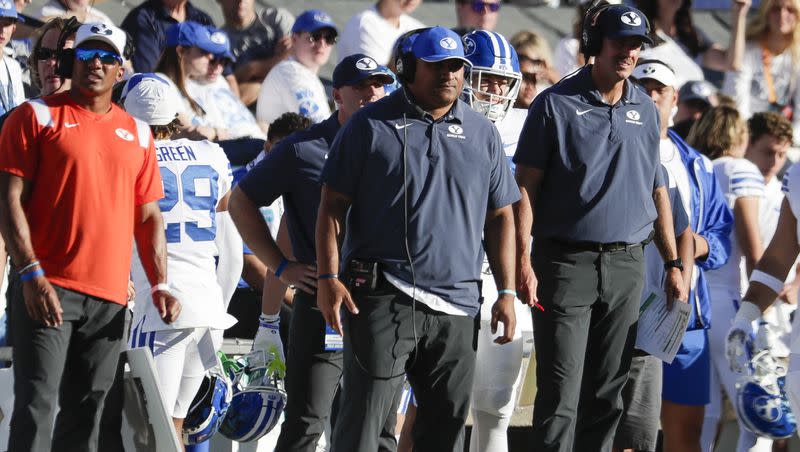 BYU coach Kalani Sitake, center, stands on the sideline as his team plays Arkansas Razorbacks in Provo on Saturday, Oct. 15, 2022. The Cougars begin 10 straight games against Power Five foes on Saturday.