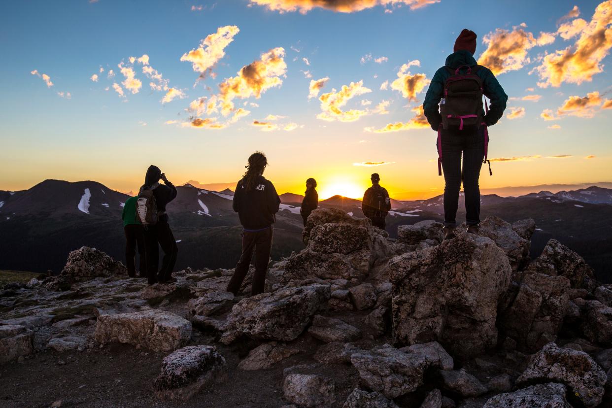 Visitors watch the sunset near Rocky Mountain National Park's Alpine Visitor Center.