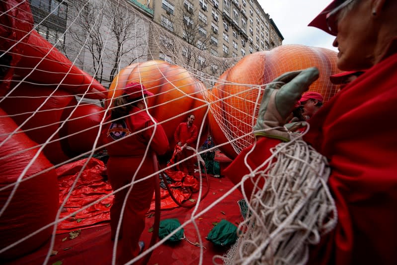 The Macy's Thanksgiving Day Parade inflation team make preparations for the Jett by Super Wings balloon in New York