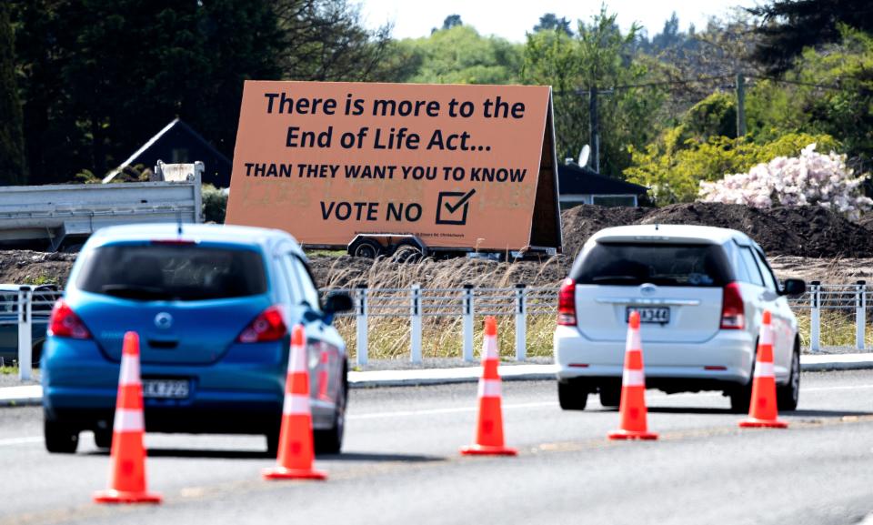 In this Oct. 16, 2020, file photo, cars are driven past a billboard urging voters to vote "No" against euthanasia in Christchurch, New Zealand. New Zealanders have voted on Friday, Oct. 30, 2020 in favor of legalizing euthanasia in a binding referendum.