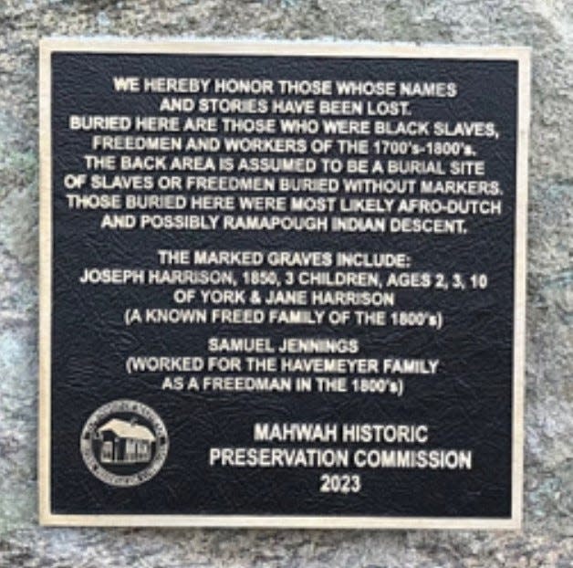 Closeup view of plaque installed by Mahwah Historic Preservation Commission this year commemorating slaves buried at the site.