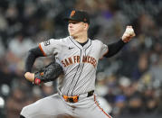 San Francisco Giants starting pitcher Kyle Harrison works against the Colorado Rockies in the seventh inning of a baseball game Tuesday, May 7, 2024, in Denver. (AP Photo/David Zalubowski)