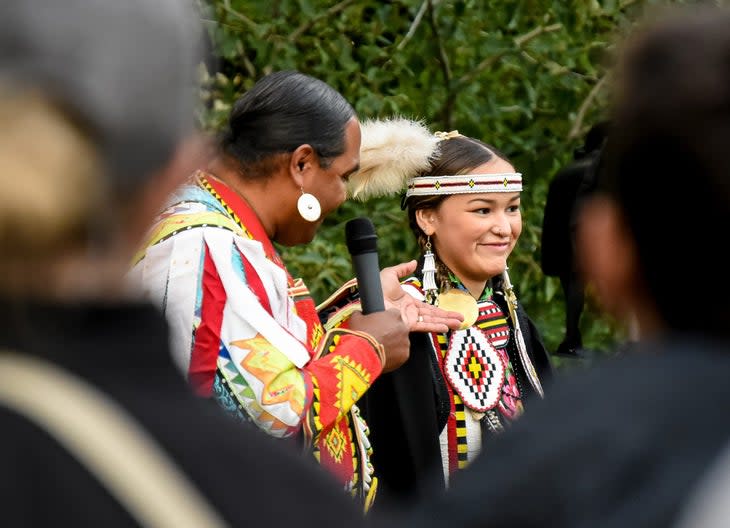 <span class="article__caption">A presenter is introduced at the Native America Speaks series in Glacier National Park, Montana. Starting in 1982, to show visitors the history of Glacier’s first inhabitants, this is the longest Indigenous speaker series in the park service.</span> (Photo: Andrew Smith/Glacier Conservancy)