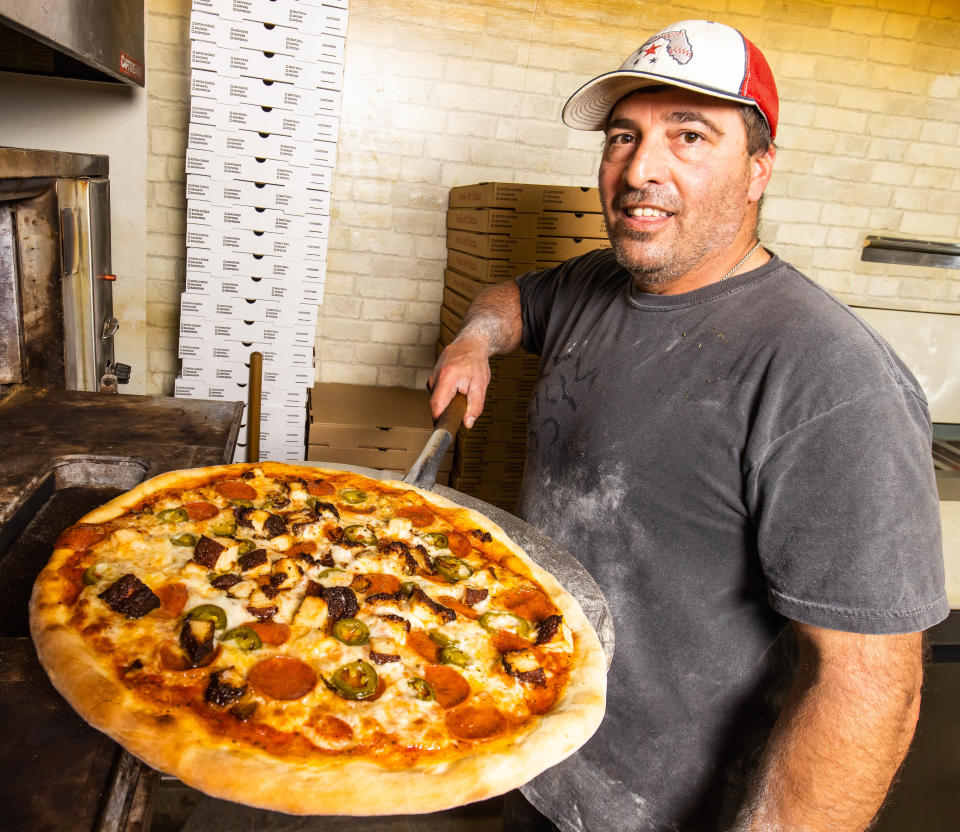 Johnny Ragosta makes pizzas Tuesday afternoon, February 7, 2023 at Johnny's Pizzeria located at 9562 SE Maricamp Rd., Unit 3 in Ocala near Silver Springs Shores. Ragosta says that the dough is the key to the perfect pizza.  [Doug Engle/Ocala Star Banner]2022