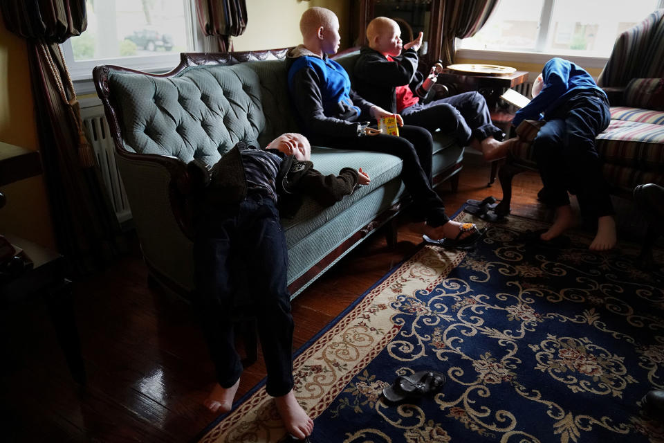 <p>Baraka Lusambo, 7, Pendo Noni 16, Emmanuel Rutema, 15, and Mwigulu Magesaa 14, Tanzanians with albinism who had body parts chopped off in witchcraft-driven attacks, relax after eating a big dinner at a home in the Staten Island borough of New York City, June 4, 2017. (Photo: Carlo Allegri/Reuters) </p>