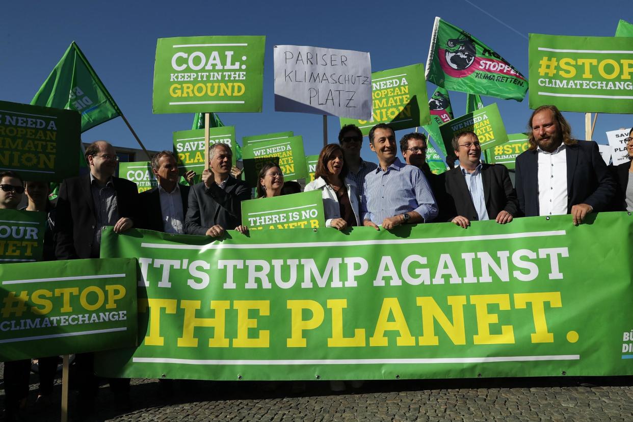 Members of the German Greens Party protest outside the US Embassy in Berlin against the announcement by Donald Trump that he will pull the US out of the Paris agreement: Getty