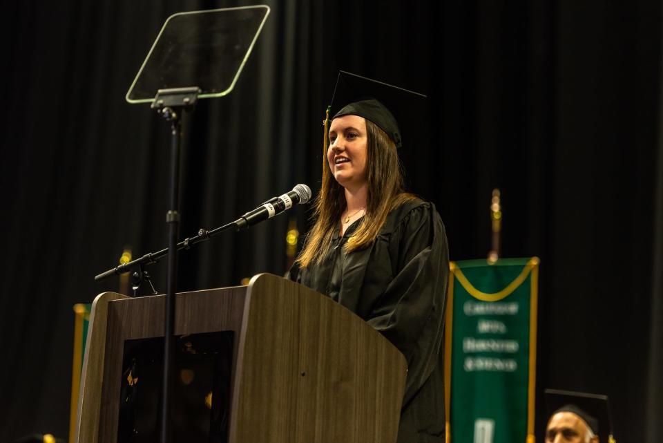 Distinguished graduate Jillian Drinkard, who received her Bachelor of Science in business administration, delivers a message to her fellow graduates on Saturday, Dec. 10, 2022.