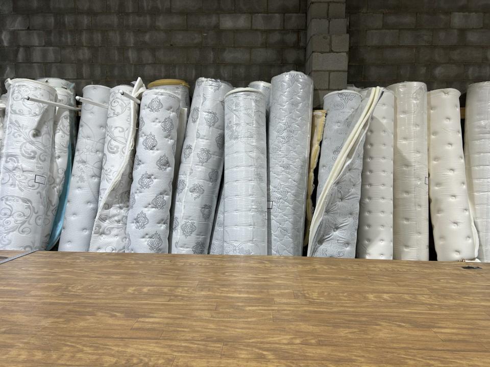 Mattress covers line up on a wall in the new manufacturing location of Winndom Mattress on Randolph Road in Hopewell.