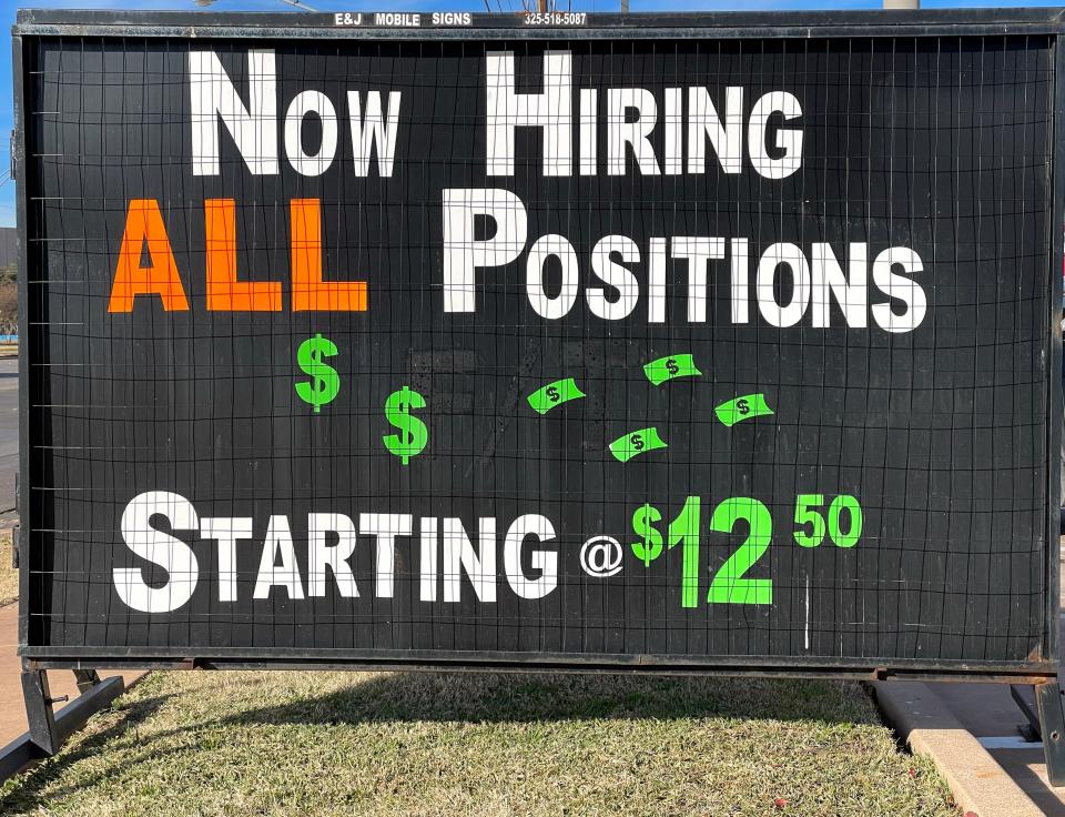 A sign outside a fast food restaurant advertising for workers Dec. 2, 2022.