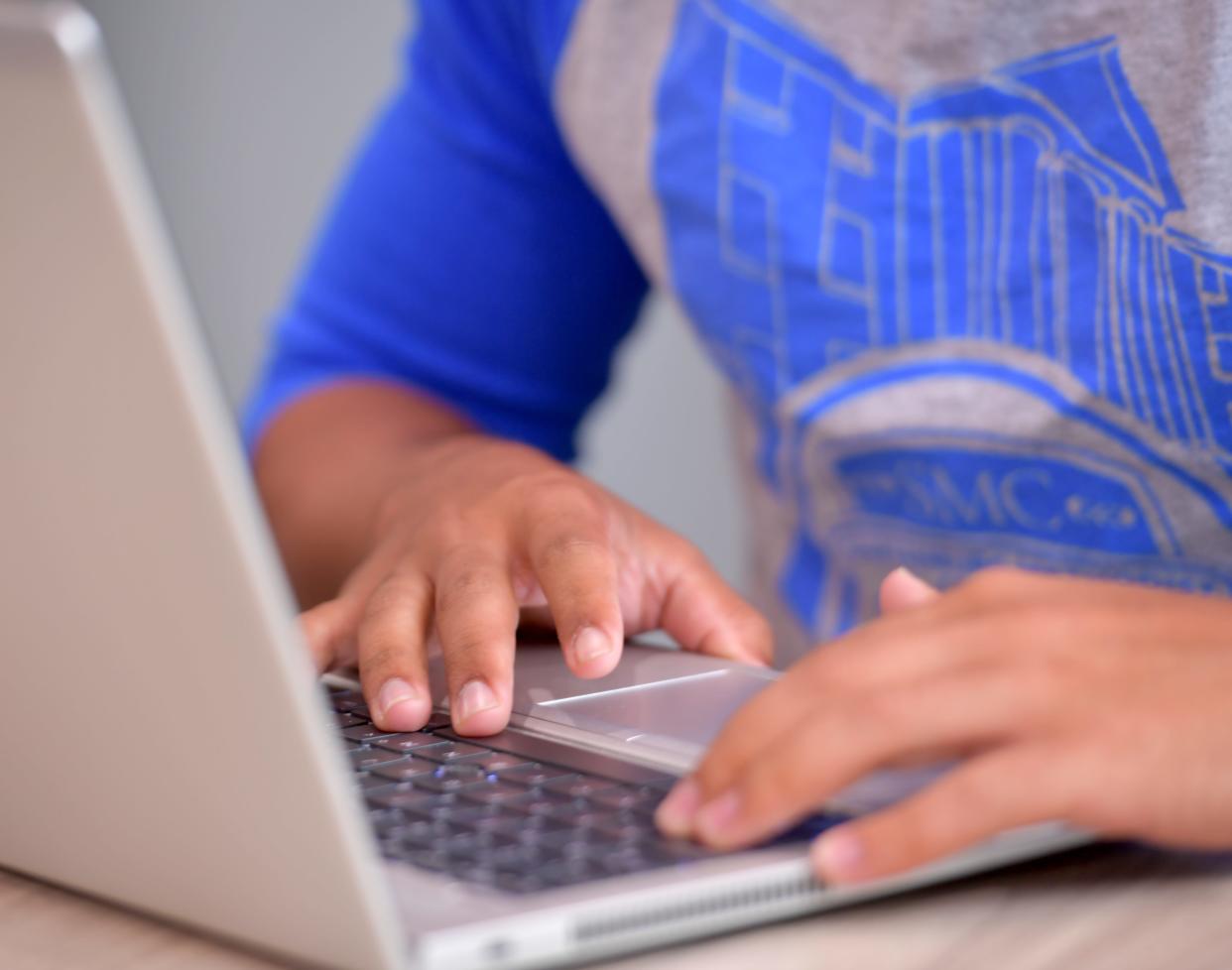 Spartanburg Methodist College financial aid director Kyle Wade talks about the FAFSA, one-on-one sessions available for high school seniors offered by the school. Here, a student looks over his FAFSA information online.