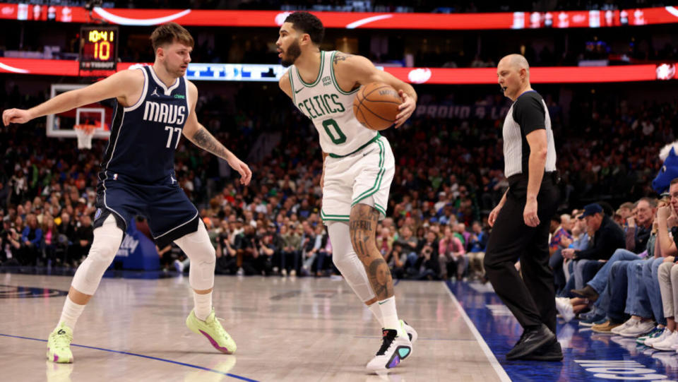 DALLAS, TEXAS - JANUARY 22: Jayson Tatum #0 of the Boston Celtics is guarded by Luka Doncic #77 of the Dallas Mavericks in the second half at American Airlines Center on January 22, 2024 in Dallas, Texas. NOTE TO USER: User expressly acknowledges and agrees that, by downloading and or using this photograph, User is consenting to the terms and conditions of the Getty Images License Agreement. (Photo by Tim Heitman/Getty Images)