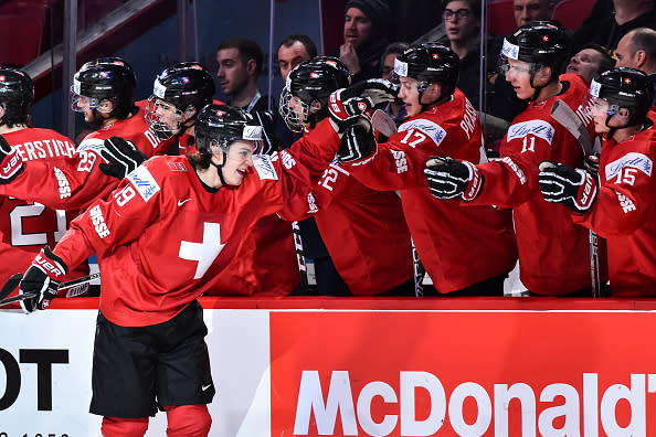 MONTREAL, QC - DECEMBER 30: Yannick Zehndery #19 of Team Switzerland celebrates his third period goal with teammates on the bench during the 2017 IIHF World Junior Championship preliminary round game against Team Denmark at the Bell Centre on December 30, 2016 in Montreal, Quebec, Canada. (Photo by Minas Panagiotakis/Getty Images)