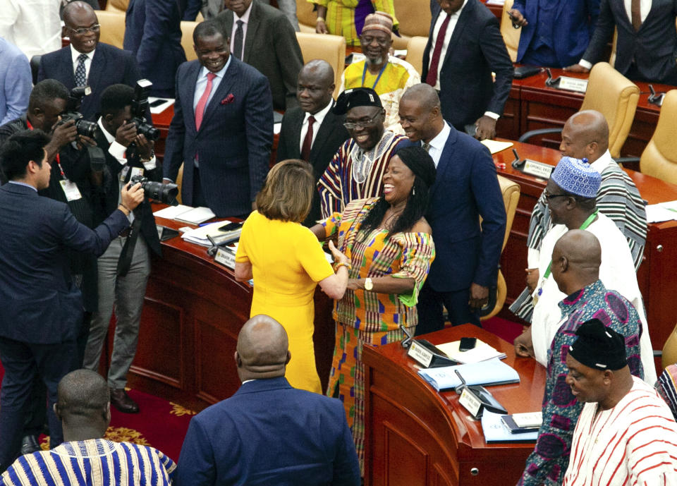 US House Speaker Nancy Pelosi shakes hands with members of Ghana's Parliament as she exits the chamber, in Accra, Ghana, Wednesday, July 31, 2019. Pelosi and other members of the U.S. Congress plan discussions on "regional security, sustainable and inclusive development and the challenges of tomorrow including the climate crisis." (AP Photo/Christian Thompson)