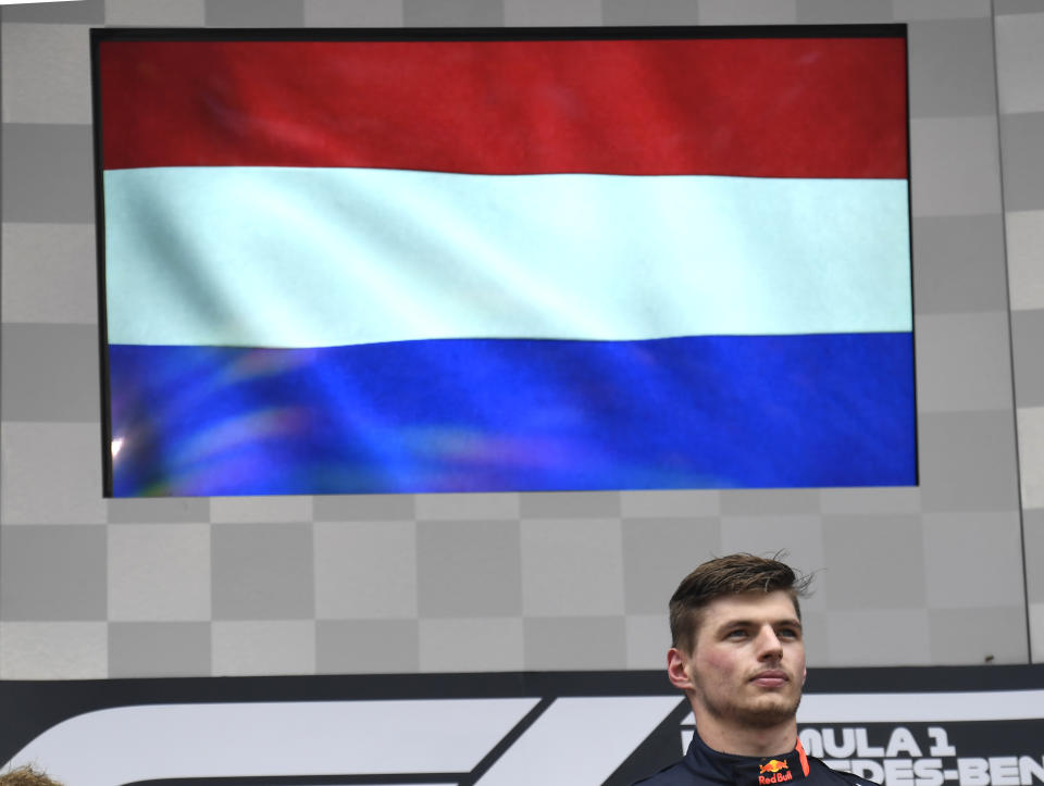 Red Bull driver Max Verstappen of the Netherland's stands on the podium during the Dutch national anthem after he won the German Formula One Grand Prix at the Hockenheimring racetrack in Hockenheim, Germany, Sunday, July 28, 2019. (AP Photo/Jens Meyer)