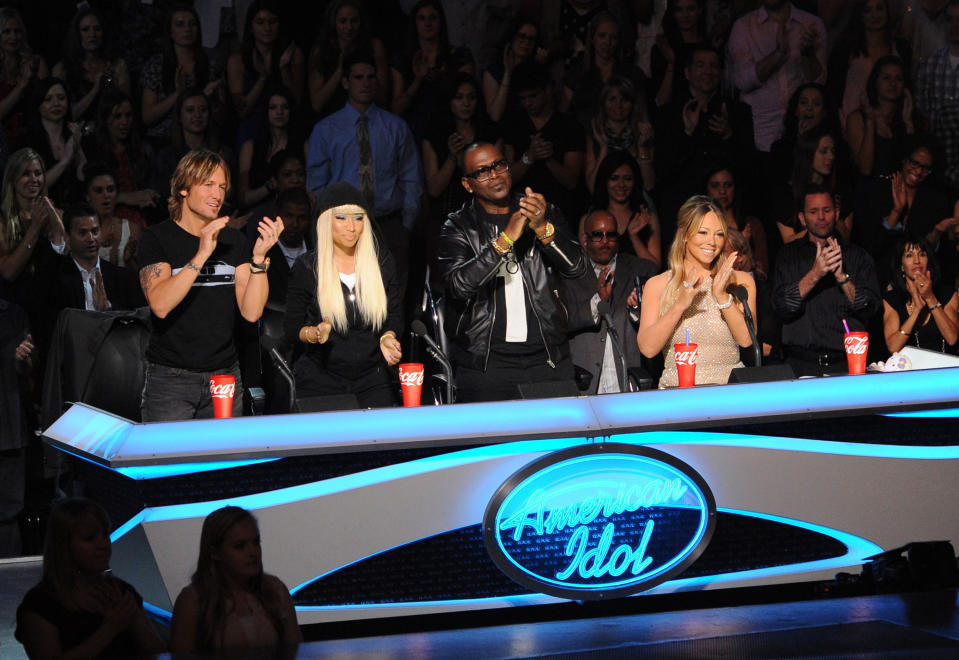 This undated image released by Fox shows judges, from left, Keith Urban, Nicki Minaj, Randy Jackson and Mariah Carey from the singing competition series, "American Idol," airing Wednesdays and Thursdays on Fox. In its 12th season, "American Idol" is managing to hit the right notes with sponsors if not always with fickle viewers. It has retained its status as TV's advertising leader among series and the loyalty of its biggest backers, including Ford and Coca-Cola. (AP Photo/Fox, Frank Micelotta)