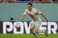 Switzerland's Xherdan Shaqiri controls the ball during the World Cup group G soccer match between Serbia and Switzerland, at the Stadium 974 in Doha, Qatar, Friday, Dec. 2, 2022. (AP Photo/Martin Meissner)