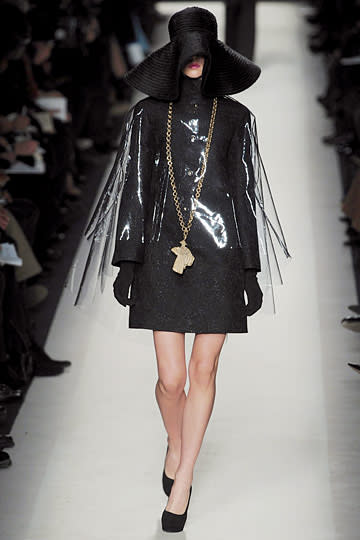 This YSL plastic cape is like a slipcover from your clothes!