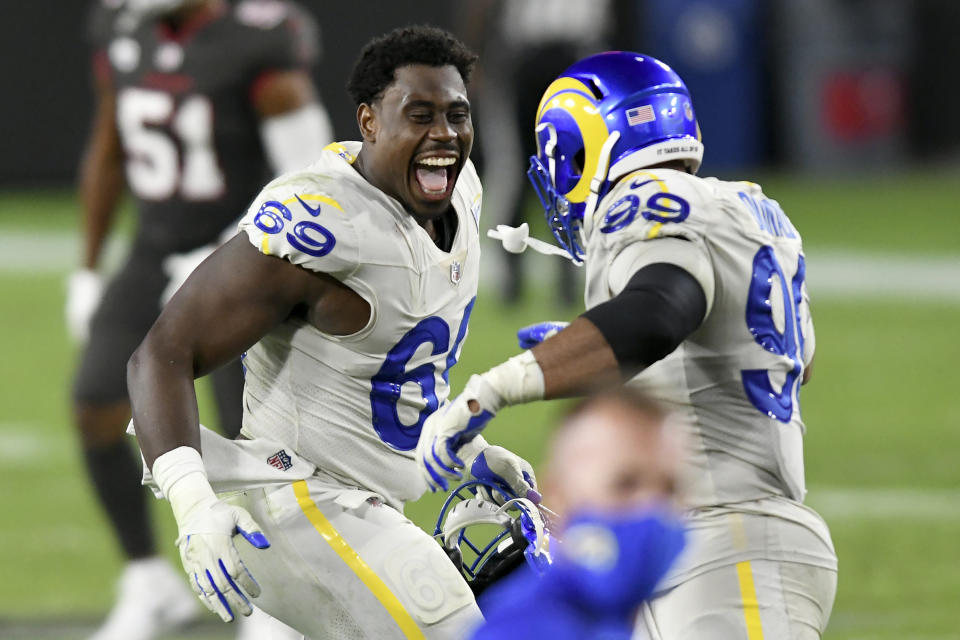 Los Angeles Rams nose tackle Sebastian Joseph-Day (69) celebrates with defensive end Aaron Donald (99) after the team defeated the Tampa Bay Buccaneers during an NFL football game Monday, Nov. 23, 2020, in Tampa, Fla. (AP Photo/Jason Behnken)