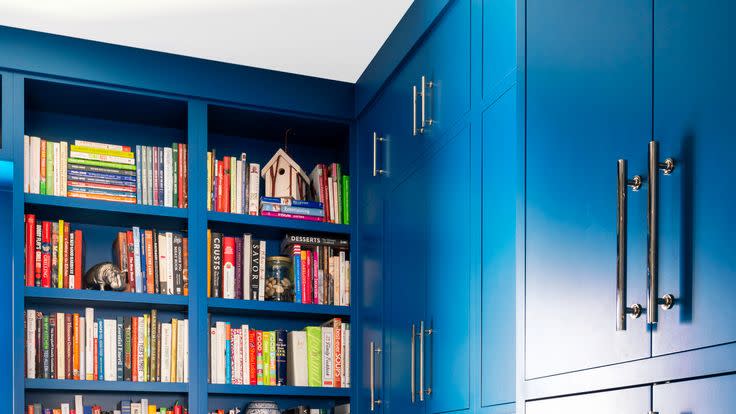 blue kitchen with built in shelves for cookbooks designer jessica davis of jl design