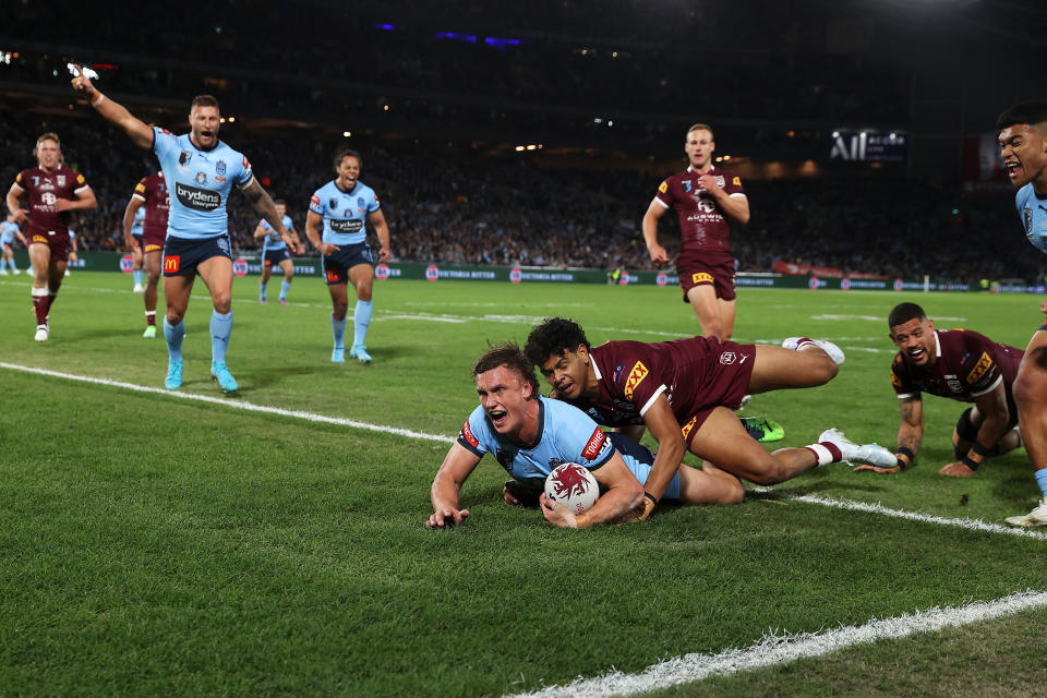 SYDNEY, AUSTRALIA - JUNE 08: Jack Wighton of the Blues celebrates scoring a try during game one of the 2022 State of Origin series between the New South Wales Blues and the Queensland Maroons at Accor Stadium on June 08, 2022, in Sydney, Australia. (Photo by Mark Kolbe/Getty Images)