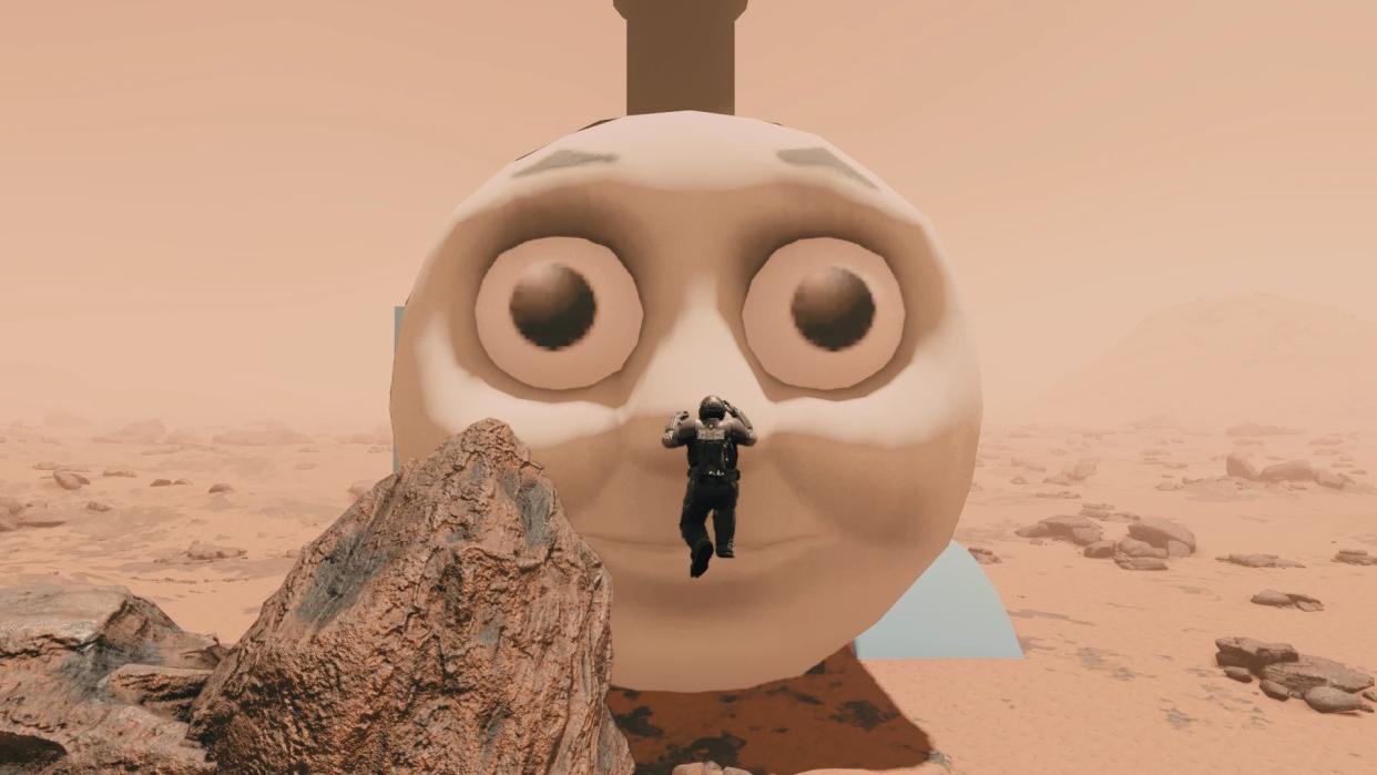  Thomas The Tank Engine's massive face smiles down at a Starfield character. 