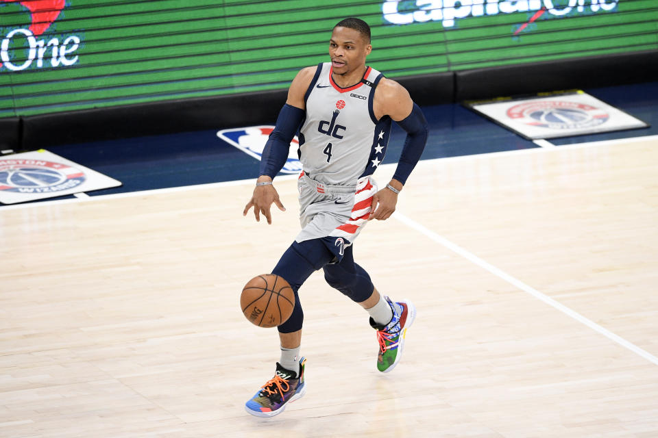 Washington Wizards guard Russell Westbrook dribbles the ball during the first half of an NBA basketball game against the Charlotte Hornets, Sunday, May 16, 2021, in Washington. (AP Photo/Nick Wass)