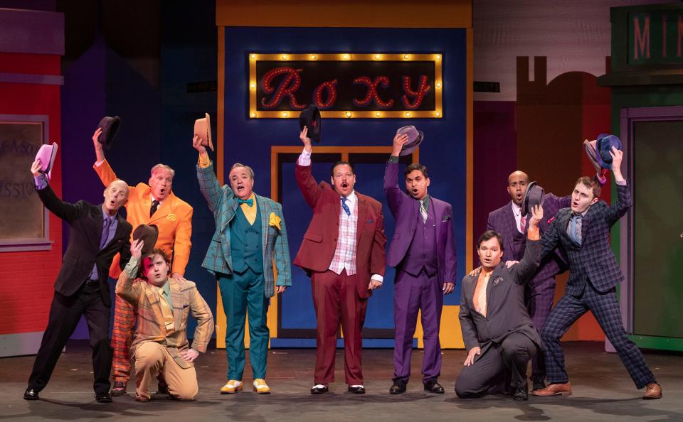 Actors perform a scene from Guys and Dolls at the Lake Worth Playhouse on January 18, 2023. 