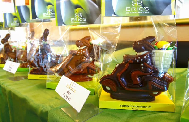 FILE PHOTO: Chocolate Easter bunnies on scooters are displayed at Eric's Confiserie Baumann in Zurich