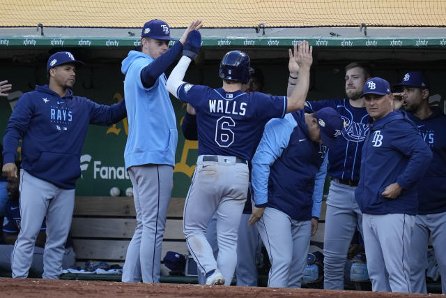 Toronto Blue Jays' Rickey Henderson, left, celebrates with teammate