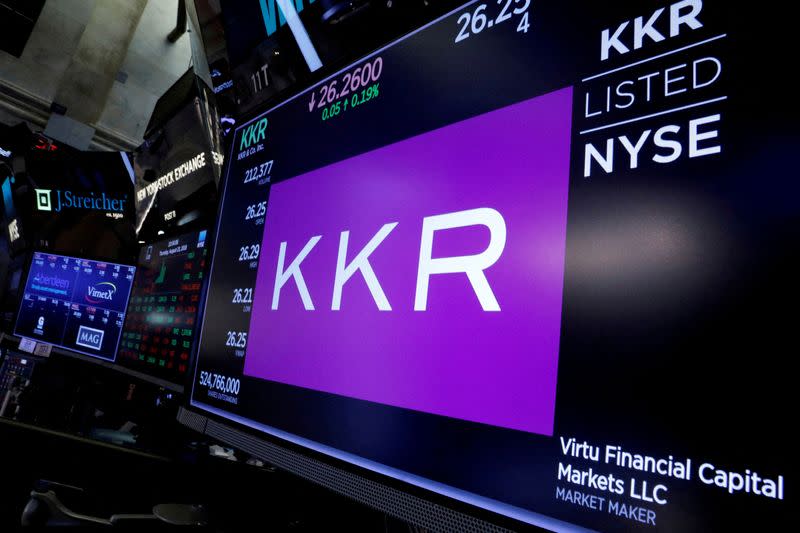 FILE PHOTO: KKR & Co trading information is displayed on a screen on the floor of the NYSE in New York