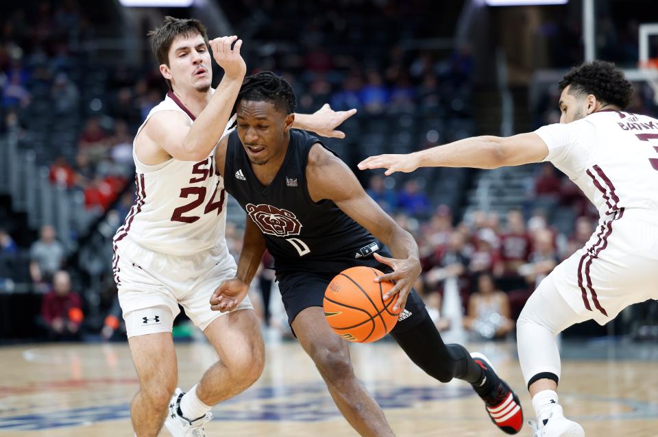 Missouri State's Chance Moore (0) moves around Southern Illinois' Trent Brown (24) during a Missouri Valley Conference Tournament game, Friday, March 3, 2023, at Enterprise Center in St. Louis. 