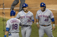 New York Mets Michael Conforto (30) is congratulated by his teammates Ryan Cordell (18) and Wilson Ramos (40) after hitting a home run during the fourth inning of a baseball game against the Washington Nationals in Washington, Tuesday, Aug. 4, 2020. Ramos also scored. (AP Photo/Manuel Balce Ceneta)