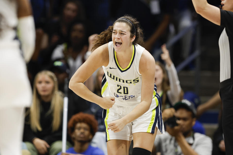 Dallas Wings forward Maddy Siegrist (20) celebrates a three-point shot during a WNBA basketball game against the Chicago Sky, Wednesday, May 15, 2024, in Arlington, Texas. Dallas won 87-79. (AP Photo/Brandon Wade)