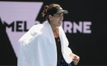 Spain's Garbine Muguruza walks from the court after defeating Marketa Vondrousova of the Czech Republic in a tuneup event ahead of the Australian Open tennis championships in Melbourne, Australia, Saturday, Feb. 6, 2021.(AP Photo/Andy Brownbill)