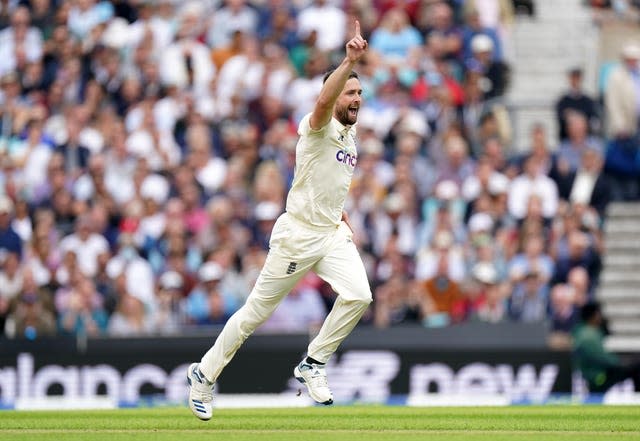 Chris Woakes celebrates his first wicket