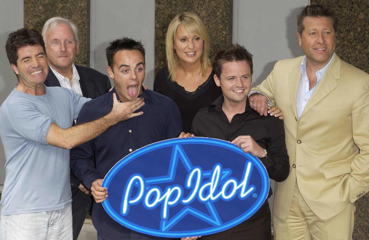 Pop Idol judges (from left) Simon Cowell, Pete Waterman, Nicki Chapman and Neil Fox, pose with show hosts Ant and Dec (Anthony McPartlin & Declan Donnelly) during a press conference at Thames TV in London, to launch a new series of Pop Idol.   (Photo by PA Images via Getty Images)